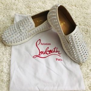 (Red Bottom) Christian Louboutin spiked loafers.